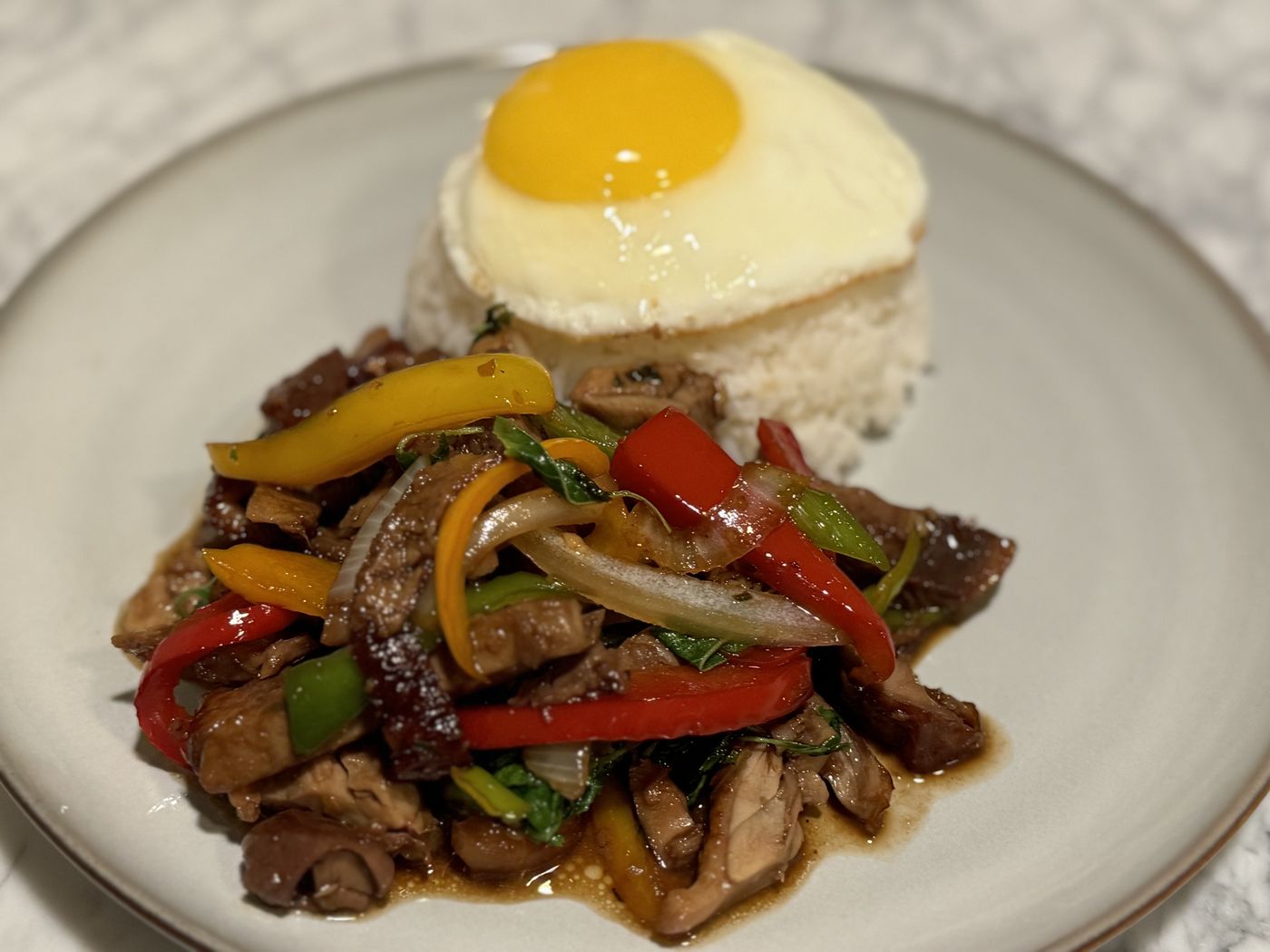 Pad kra prao with rice and a fried egg