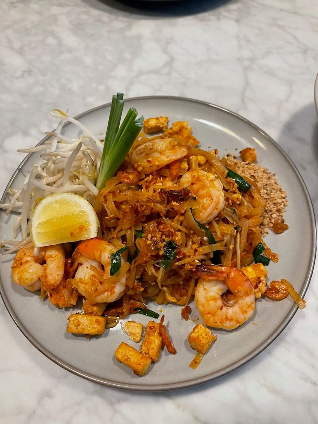 Pad Thai with shrimp, tofu, peanuts, and bean sprouts